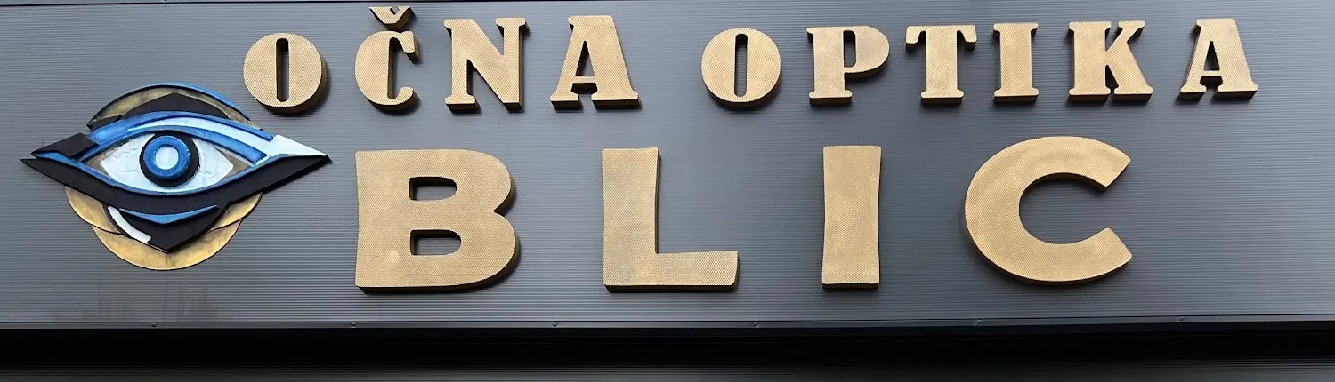 Zlatni natpis Očna optika Blic s muralom oka na fasadi